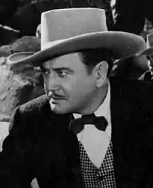 Richard Dix en una escena d'a cinta The Kansan (1953).