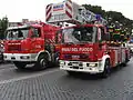 Italian Fire Service vehicles with an Astra crane on the left and a Magirus turntable ladder on the right, Army Parade in Rome, 2 June 2006.