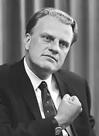 A black-and-white image of Billy Graham