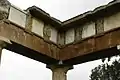 Metopes made from marble slotted into the frieze of the Stoa at Brauron.