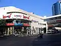 Dizengoff Center. Castro (clothing), SuperPharm and Orange (telecommunications) signs are noticeable