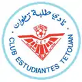 صمم شعار النادي الأول سنة 1976 وكان عبارة عن دائرة تحيط بها عبارة نادي طلبة تطوان بالعربية و"CLUB ESTUDIANTES TETUAN " باللغة الإسبانية وتعني هذه العبارة بالكامل اسم النادي. يتوسط هذا الاسم شعار النادي الذي صمم آنذاك باحترافية لما يحتويه من دلالات توحي إلى اسم النادي الذي تم اختصاره في نادي طلبة تطوان