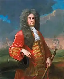 Painting of a middle-aged man wearing a long flowing wig and a red coat with gold frogging, resting his right arm on a cannon and holding a rammer in his left hand. A fleet of ships is visible in the background.