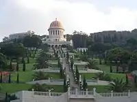 Large white buildings in a landscape garden.