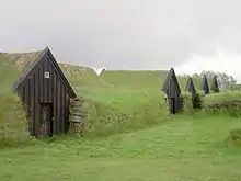 Keldur Earth covered homes with grass growing on the top