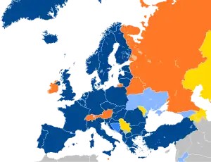 A map of Europe with countries in blue, cyan, orange, and yellow based on their NATO affiliation.