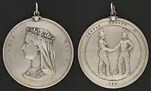 Two sides of a silver medal: the profile of Queen Victoria and the inscription "Victoria Regina" on one side, a man in European garb shaking hands with an Aboriginal with the inscription "Indian Treaty 187" on the other