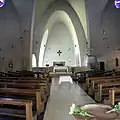 L'altar de la ilesia de San Engelberto (Colonia) amuesa la simplicidá decorativa de les ilesies del sieglu XX.