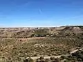 Vista del términu dende l'allugamientu del antiguu castiellu, direición este. Al fondu la Piedra Gredal col Buecu de la Campana.