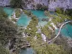 Turqois colored lakes among white rocks.