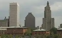 Three buildings, two of the same stature, and one smaller than the others