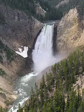 Large waterfall in a rocky mountain landscape.