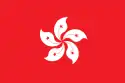 A flag with a white 5-petalled flower design on solid red background