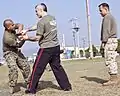 David Kahn, center, teaches U.S. Marine Corps Sgts. Enrique D. Watson, right, and Bernardo Leyva, left, Headquarters and Headquarters Squadron, Krav Maga fighting techniques Oct. 28, 2009, at U.S. Marine Corps Air Station Iwakuni, Japan.