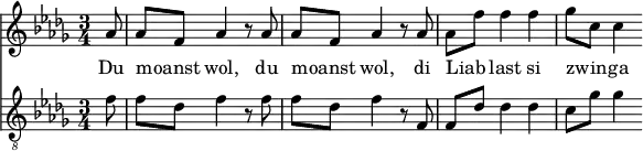 
<<
  \relative aes' {
    \key des \major
    \time 3/4
    \partial 8
    aes8 | aes f aes4 r8 aes8 | aes f aes4 r8 aes8 | aes f' f4 f | ges8 c, c4
  }
  \addlyrics {
    Du moanst _ wol, du moanst _ wol, di Liab _ last si zwin _ -- ga
  }
  \relative f' {
    \key des \major
    \clef "G_8"
    \time 3/4
    \partial 8
    f8 | f des f4 r8 f8 | f des f4 r8 f,8 | f des' des4 des | c8 ges' ges4
  }
>>
