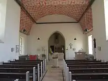 Taufstein und Altar in St. Stephan, Alerheim