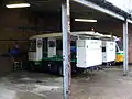 Milk floats in einer Dairy Crest Garage