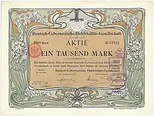 Aktie der Deutsch-Ueberseeischen Elektricitäts-Gesellschaft über 1.000 Mark, ausgestellt in Berlin im Juli 1906. Mit Faksimileunterschrift Arthur von Gwinner (Vorstand Deutsche Bank) als Aufsichtsratsvorsitzender. Die graphische Gestaltung der Aktie stammt von dem Jugendstil-Künstler Otto Eckmann. Zweck der 1898 von der Deutschen Bank und von der AEG gegründeten Gesellschaft war die Errichtung von Elektrizitätswerken vor allem in Südamerika (Buenos Aires, Santiago de Chile, Valparaiso, Montevideo).