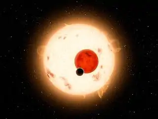 Künstlerische Darstellung des Kepler-16-Systems mit Kepler-16b (schwarz; im Vordergrund)