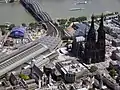 Bildmitte, von links: Kölner Hauptbahnhof, Bahnhofs­vorplatz, Treppen­stufen und Domplatte, Kölner Dom (2006)