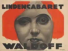 Zu sehen ist ein Werbeplakat des Lindenkabaretts. Claire Waldoff wird zeichnerisch mit feuerroten Haaren dargestellt. Der Rest des Plakats ist in schwarz-weiß gehalten. Oben steht in Großbuchstaben „Lindencabaret“ und unten ebenso in Großbuchstaben etwas größer „Waldoff“. Claires Porträt nimmt das gesamte Plakat ein.