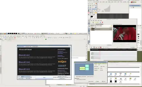 Bildschirmfoto des PC-BSD 10.1.2 Desktop, (MATE), am Beispiel einer Konfiguration mit zwei Monitoren (Dual Head, Pivot-Funktion). Die gezeigten laufende Freie Software und Open-Source-Software (FOSS) sind: GIMP, OpenShot Video Editor, Dateimanager Nautilus, Eric Python IDE und Minecraft 1.8.7 (mit "Forge" mods).