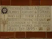 A tablet formed of five tiles of varying sizes, bordered by yellow and blue flowers in an art nouveau style