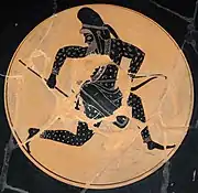 Skythischer Bogenschütze auf einer schwarzfigurigen, attischen Kylix, ca. 530 bis 520 v. C. Die Nackenlasche seiner Mütze ist hinter das Stirnband hochgesteckt.