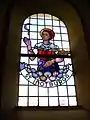 Notburga auf einem Glasfenster in der Kapelle in Görau, Oberfranken