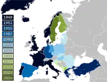 A map of Europe with countries labelled in shades of blue, green, and yellow based on when they joined NATO.