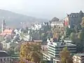 De Florentinerberg mei New Castle (top right), the Caracalla Spa (bottom right), and the Friedrichsbad (bottom left)