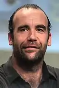 Rory McCann kòm Sandor Clegane / Le Limier.